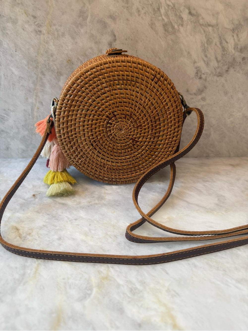 Round rattan Crossbody Bag , in Tan with Tassel Accent, floral interior